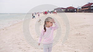 Mother With Little Child Blowing Soap Bubbles On Sea Beach Traveling with one Children Family Summer Vacation