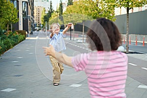 Mother and little child boy playing outdoor in the park. Happy family concept