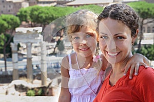 Mother and little daughter, ancient ruins in Rome