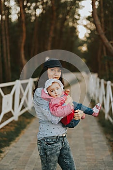 Mother and little daughter having fun on the beach. Authentic lifestyle image