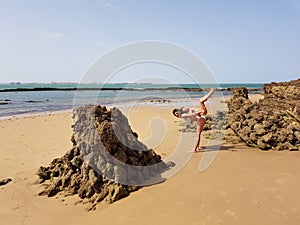 Mother and little daughter having fun on the beach