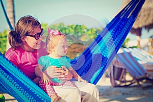 Mother and little daughter relaxed in hammock