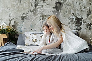 Mother and little daughter spending morning at home