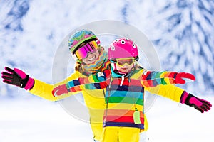 Mother and little girl learning to ski