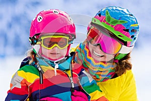 Mother and little girl learning to ski