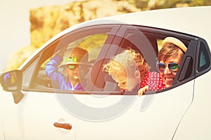 Mother with little son and daugther travel by car