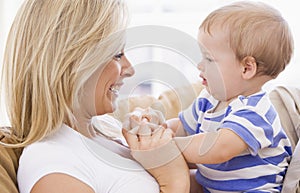 Mother in living room holding baby