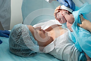 Mother look to her newborn baby in hospital