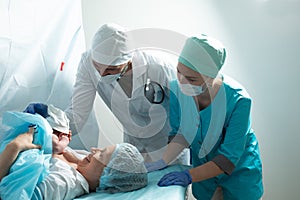 Mother look to her newborn baby in hospital