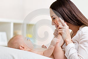 Mother looks with love at baby. Parenthood