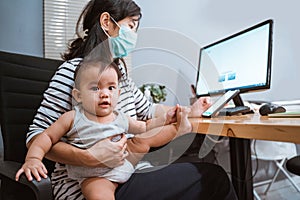 Mother with masks working from home