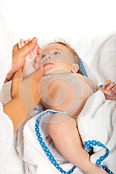 Mother massaging baby hands