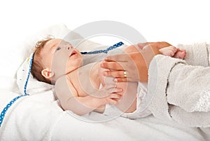 Mother massaging baby legs