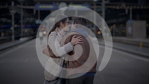 Mother Meeting Son at Train Station Talking Together after a long time