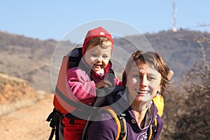 Mother mom with baby trekking