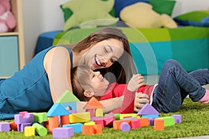 Mother or nanny playing with a child photo