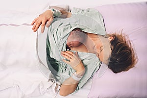 Child birth in maternity hospital. Mother and newborn. Young mom hugging her newborn baby after delivery. Woman giving birth