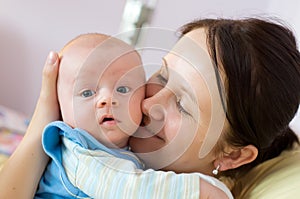 Mother with newborn smiling