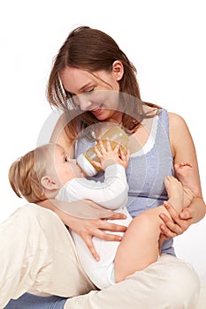 Mother playing with breastfeeding