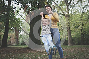 Mother playing with child. On the move.