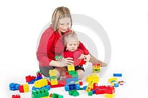 Mother playing with child over white