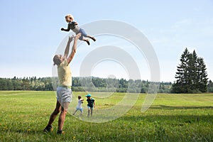 Mother playing with children