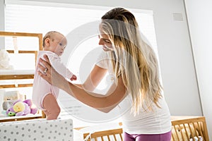 Mother playing with her baby