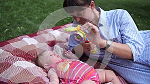 Mother playing with infant girl