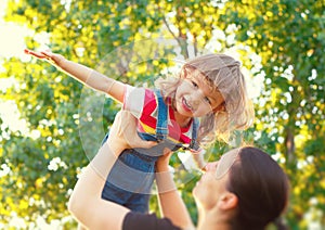 Mother playing with little daughter