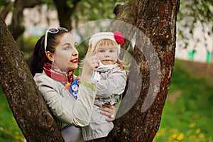 Mother points a finger the daughter something in