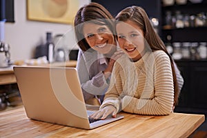 Mother, portrait and child with laptop in kitchen for learning, support or care at home. Happy mom, daughter or kid with