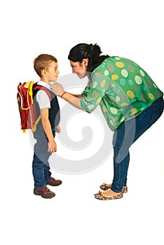 Mother prepare boy for school