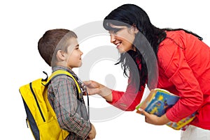 Mother preparing son for school