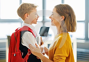 Mother preparing son for school studies