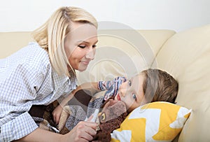 Mother putting son to sleep. Mother putting son to bed. Sweet sleeping child with lovely mom