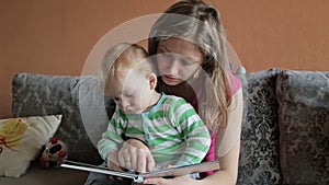 Mother is reading book for her son