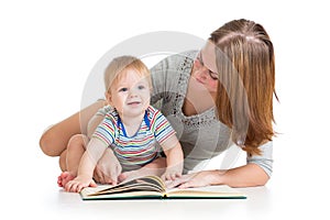 Mother reading book to baby boy