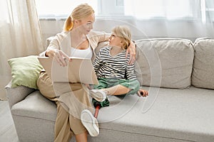 mother reading book to her attentive