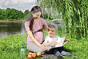 Mother reading book to her child