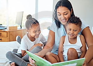 Mother reading a book to her children in a bedroom to relax, bond and learn in their family home. Happiness, education
