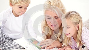Mother reading history to her two child