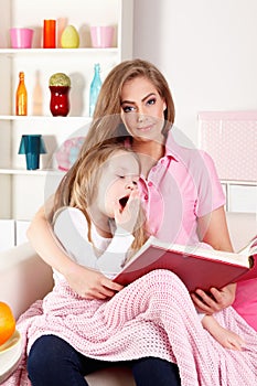 Mother reading for sick child