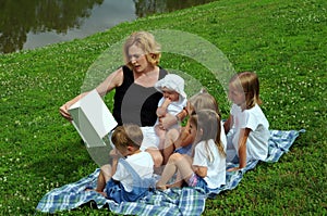 Mother Reading To Children