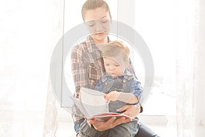 Mother reading to her child an interesting story