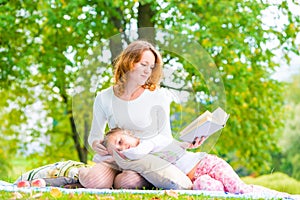 Mother reads her daughter's interesting book