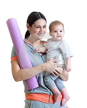 Mother ready to do fitness exercises with baby