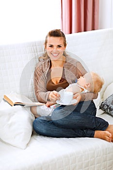 Mother resting while baby sleep by having tea