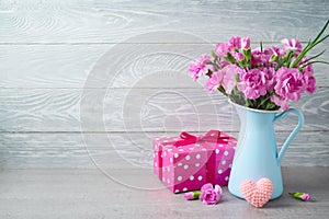 Mother`s day background with flowers, heart shape and gift box
