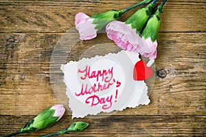 Mother`s Day card, pink carnations and note