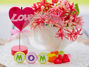 Mother`s day concept. LOVE MOM alphabet